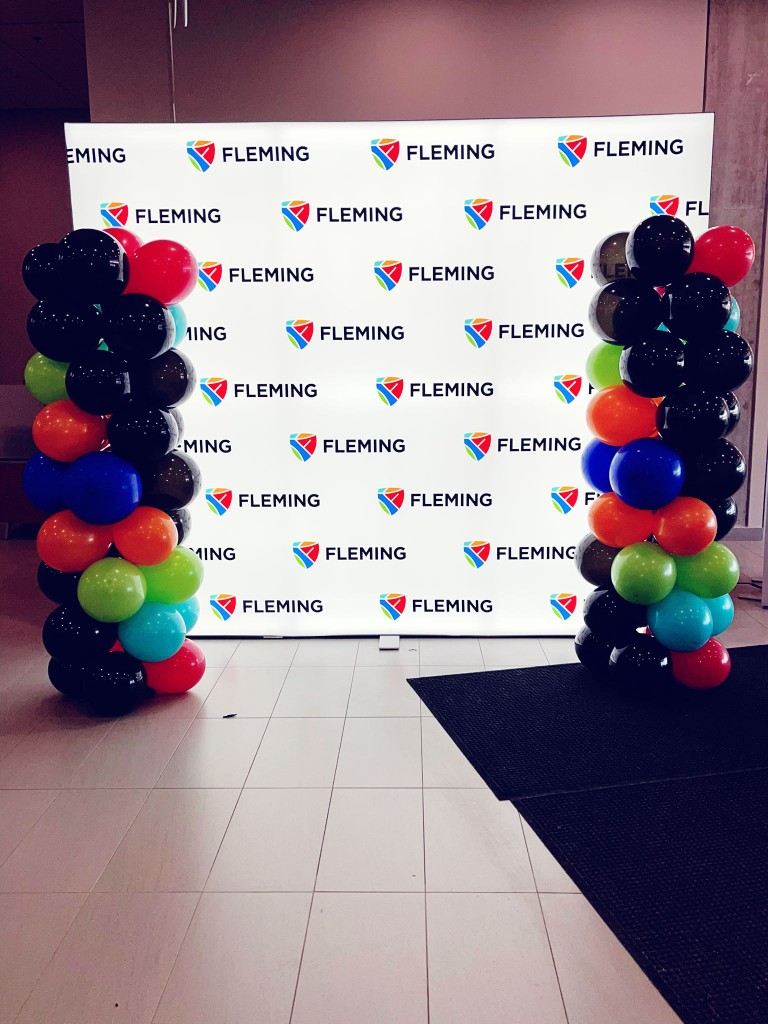 Corporate backdrop with balloon pillars