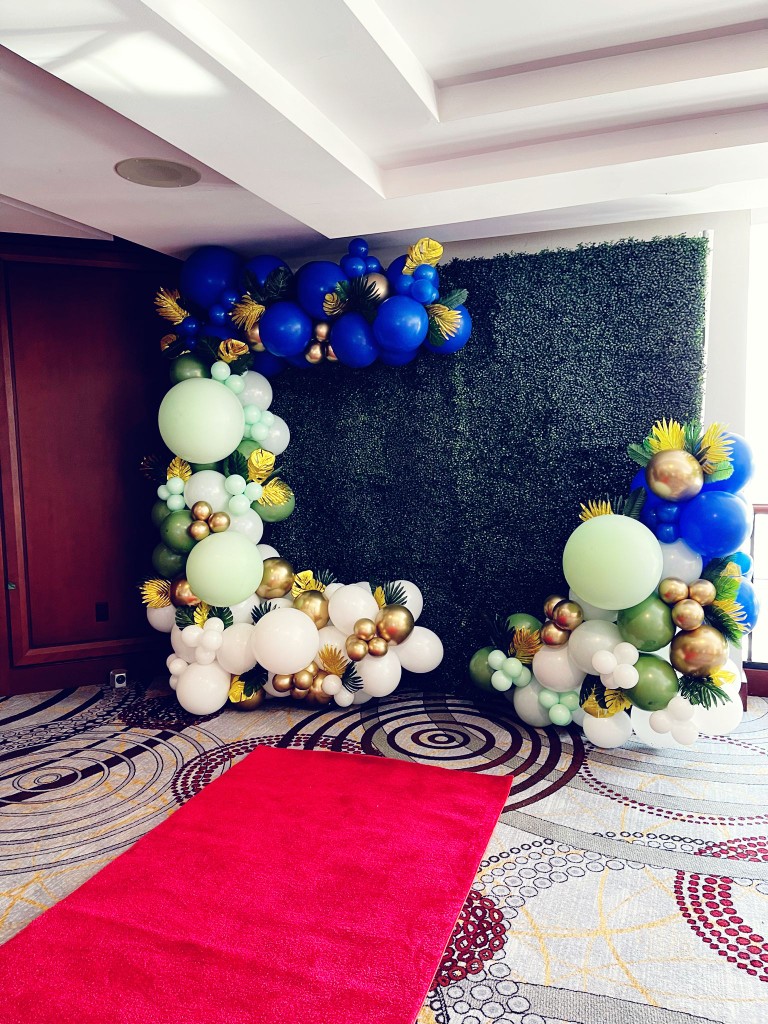 balloon decor, red carpet and flower wall