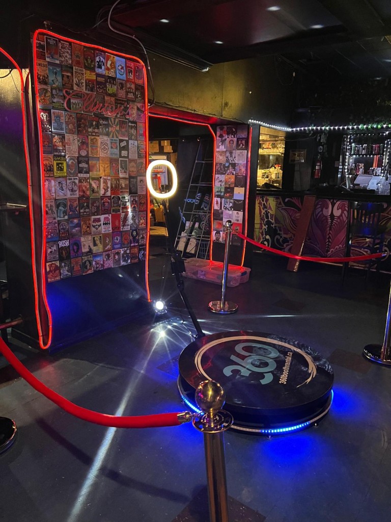 360 Video booth with stanchions and event decor