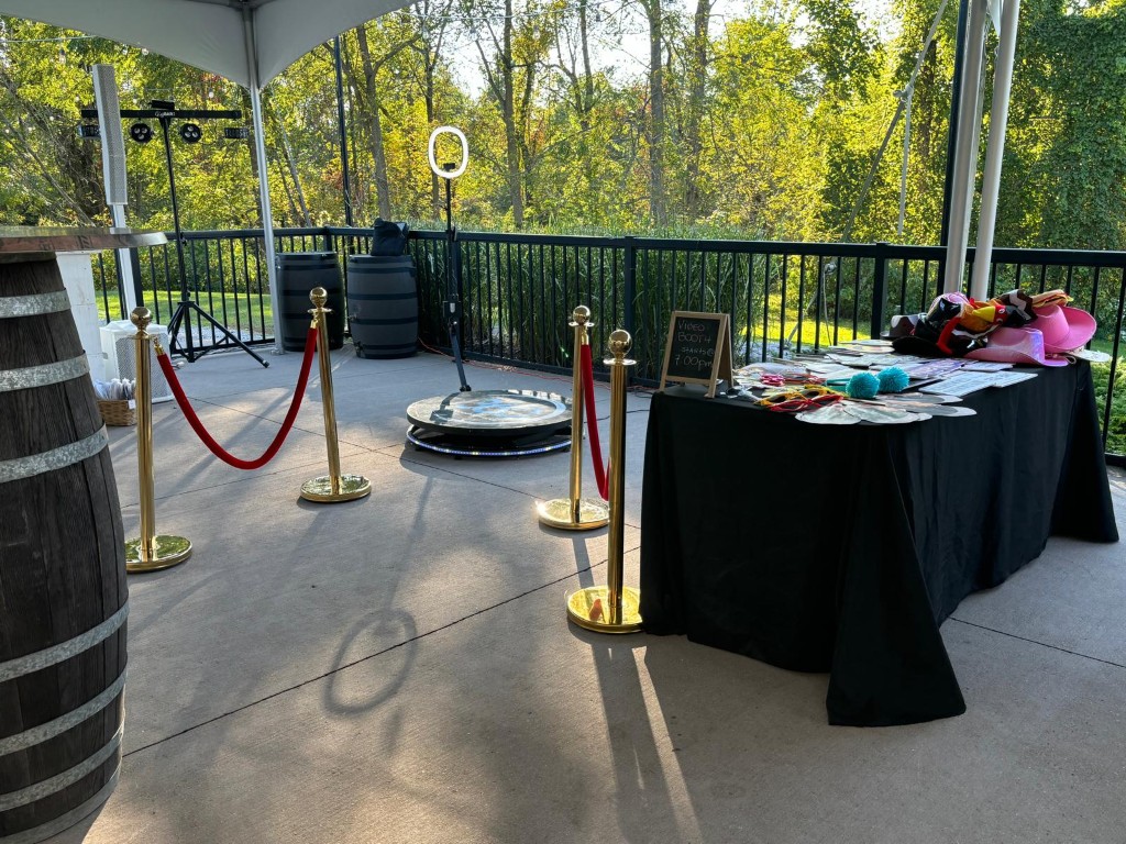 360 video booth with props and stanchions